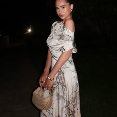 Off-shoulder printed dress with slanted neckline